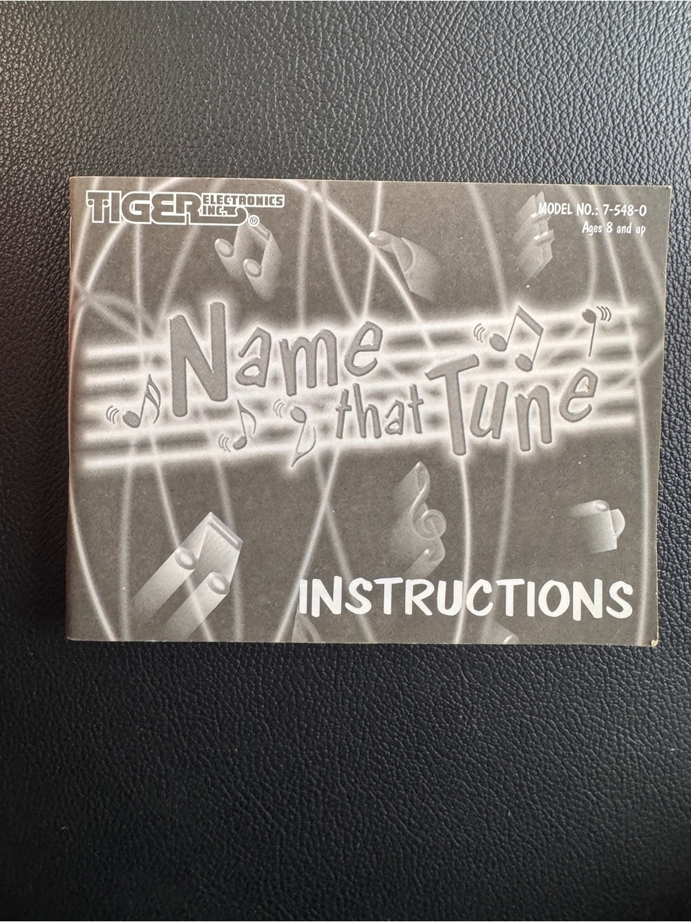 Tiger Electronics 'Name That Tune' handheld electronic game instruction booklet